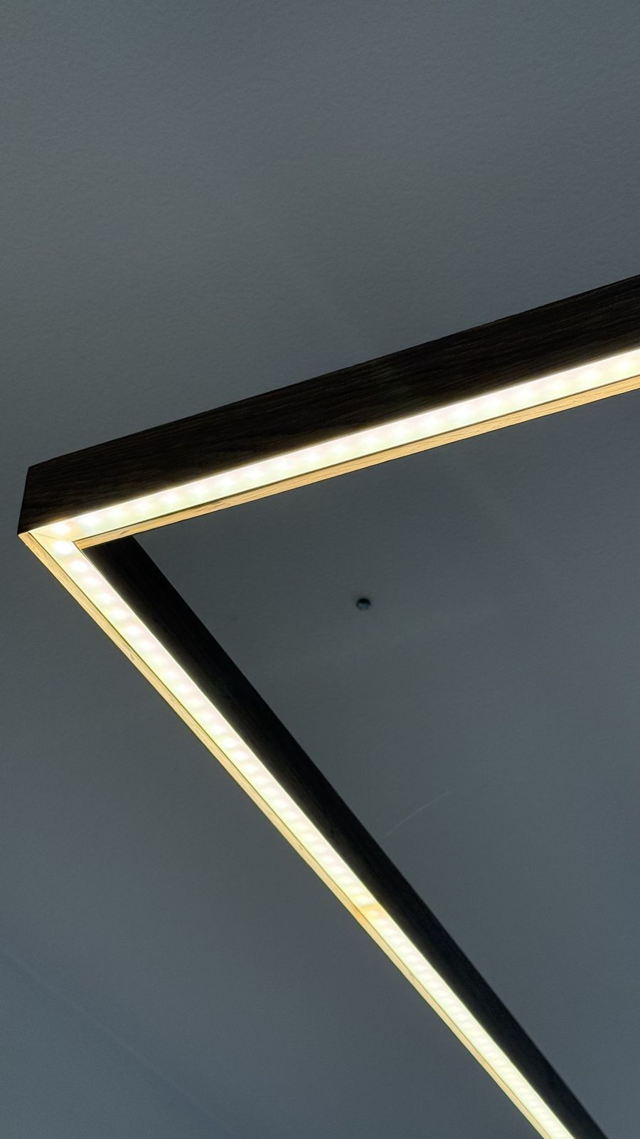 Finished corner detail showing LED wiring and joinery