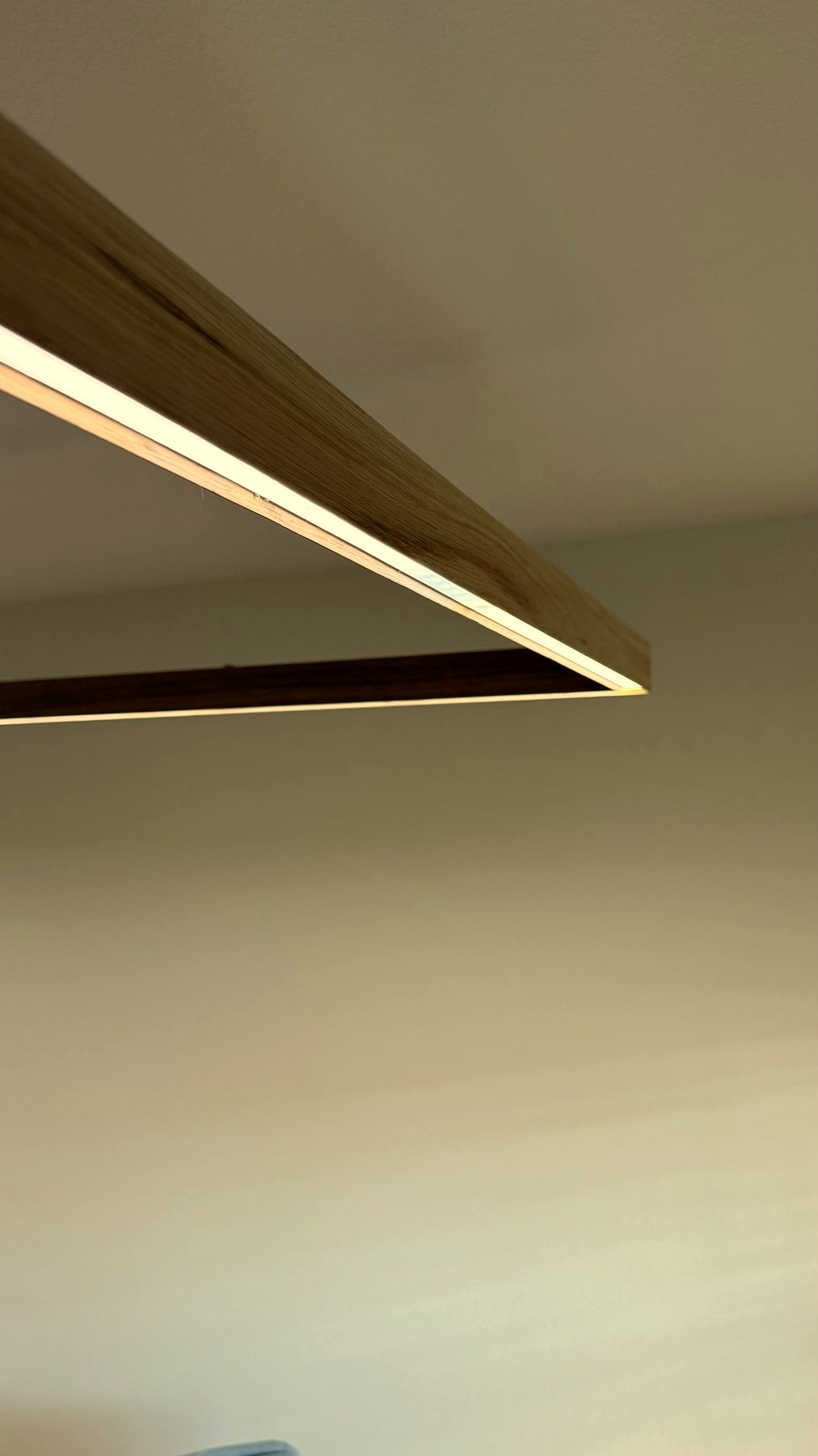 Right Angle Pendant corner detail, warm golden light, viewed from below